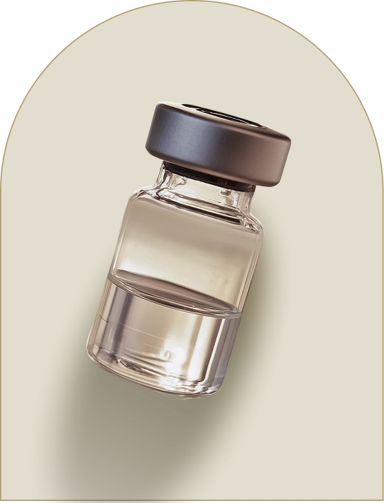 Clear glass vial with dark cap containing dermal filler product