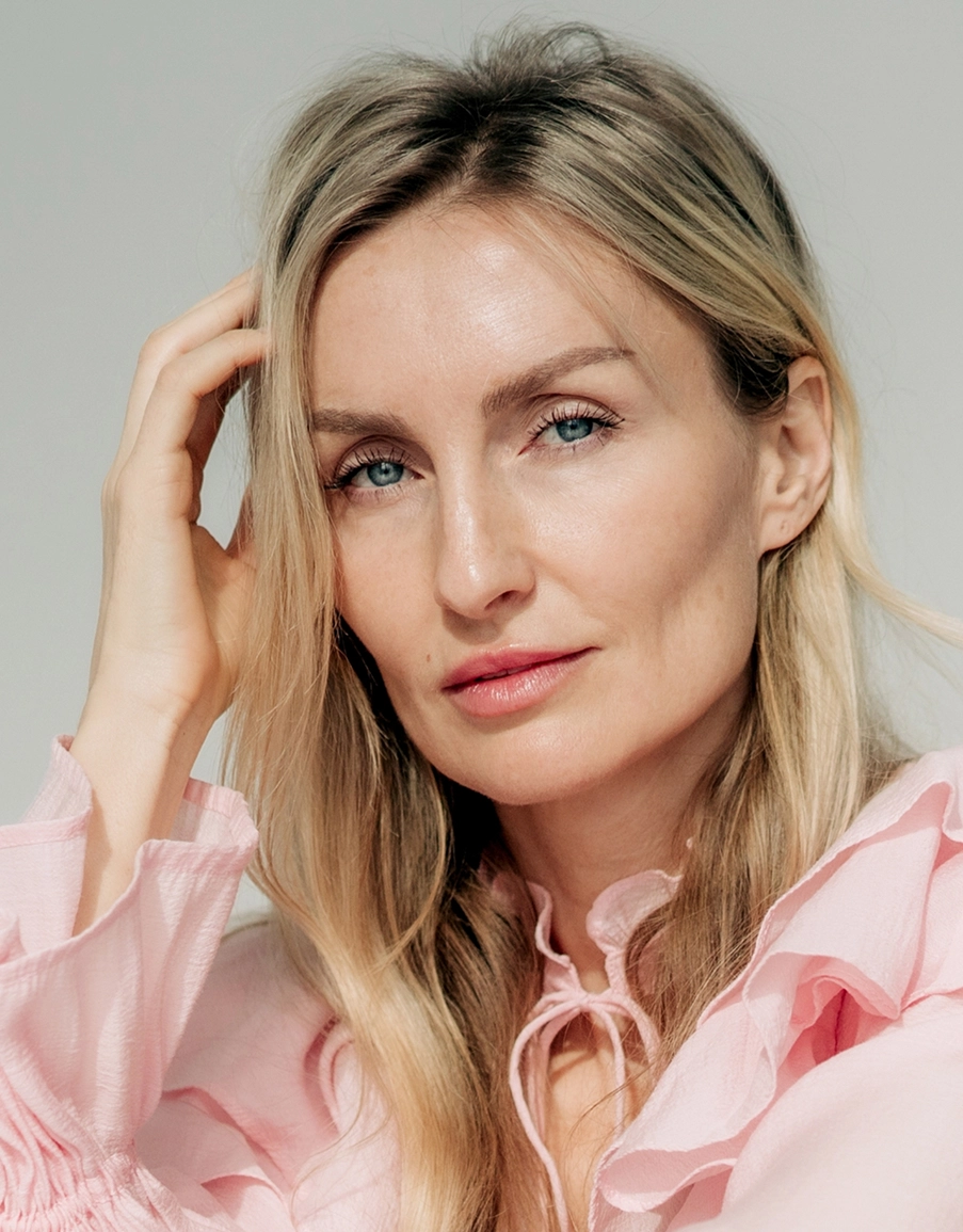 Woman with smooth, lifted skin and defined cheekbones showcasing dermal filler results