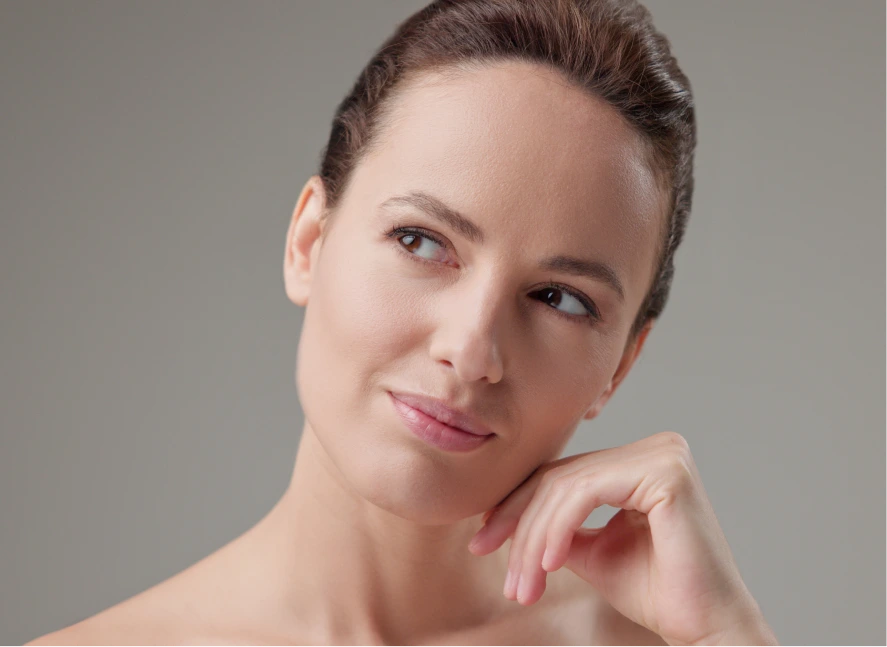 Dark-haired woman looking gently to the side